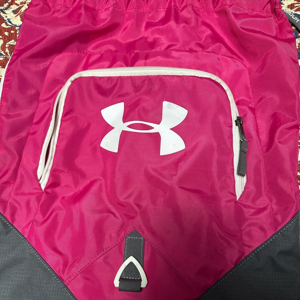 Under Armour drawstring bag, small paint stain on the back.
